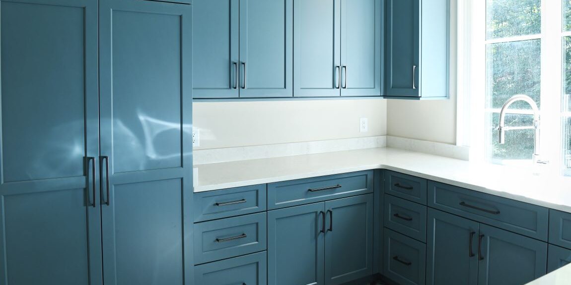 beautiful blue laundry room cabinets in a buckhead home that was recently updated