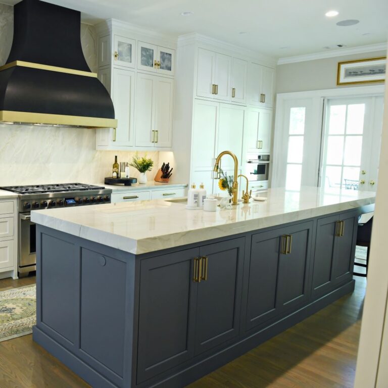 view of large blue island with white top and brass hardware in buckhead kitchen renovation