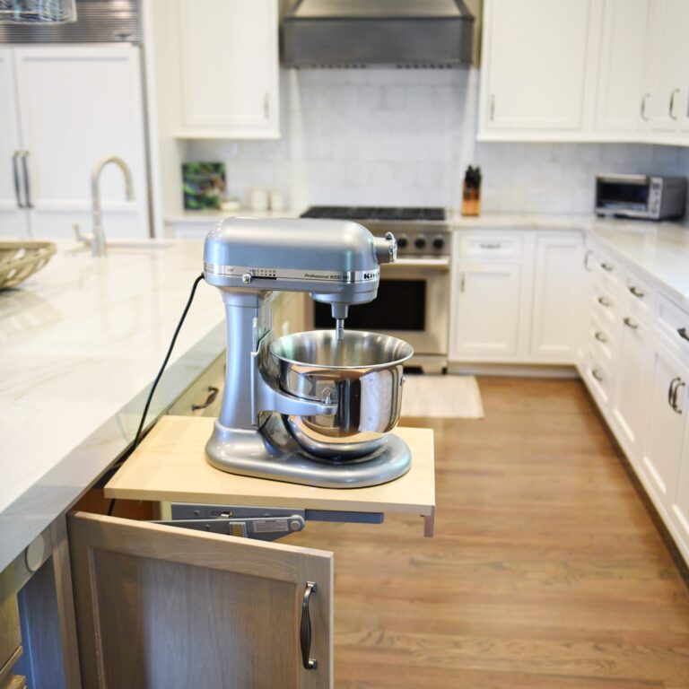 a pop up mixer stand is one of the special features in this marietta georgia kitchen renovation