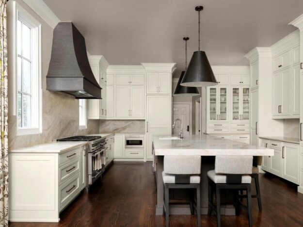 beautiful brookhaven kitchen renovation with white cabinets and countertops and a large island with seating for six