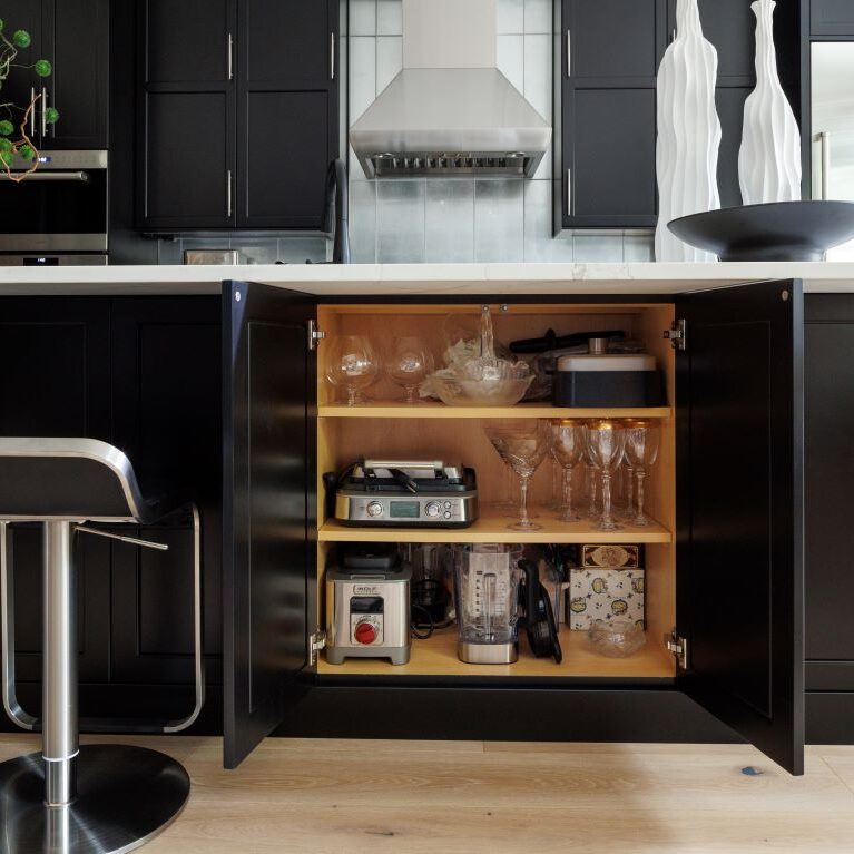 The large black island in this Alpharetta townhouse offers lots of extra storage space