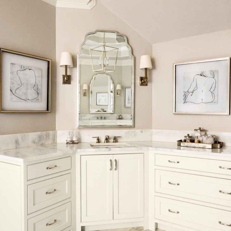 this elegant bathroom renovation in Brookhaven features two white vanities along with a steam shower, soaking tub, and linen tower