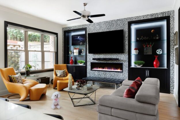 This living room has a modern and contemporary vibe with black built-in cabinetry