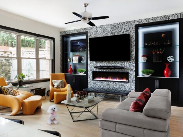 This living room has a modern and contemporary vibe with black built-in cabinetry