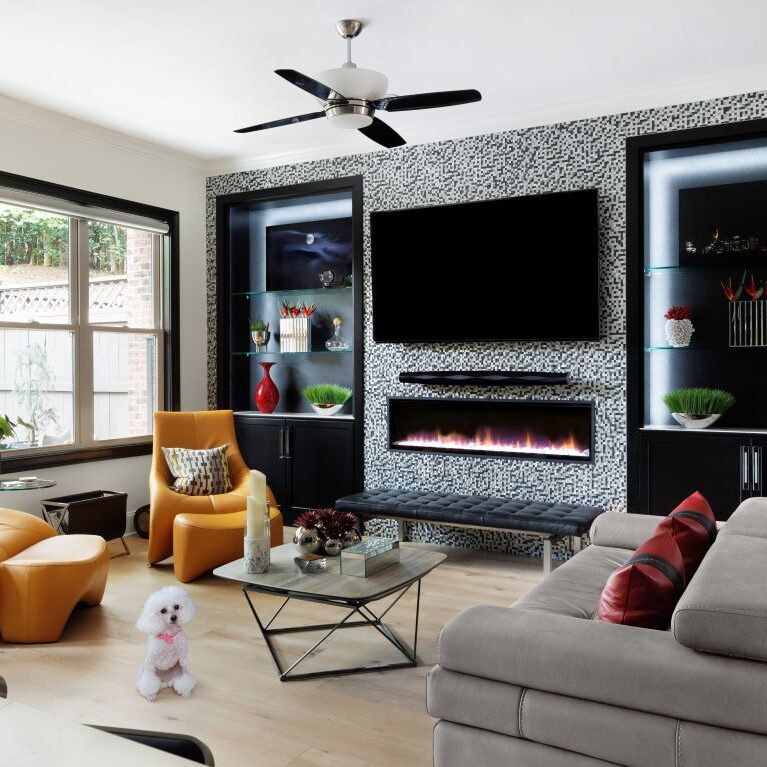 This living room has a modern and contemporary vibe with black built-in cabinetry