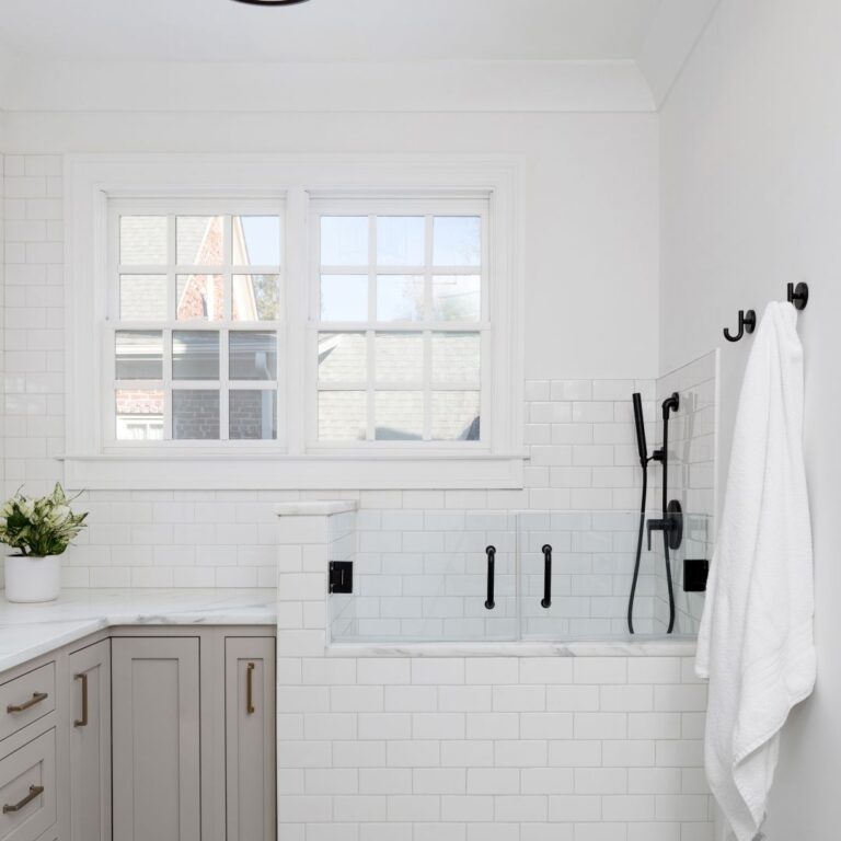 the luxurious laundry room in atlanta features a deluxe dog washing area