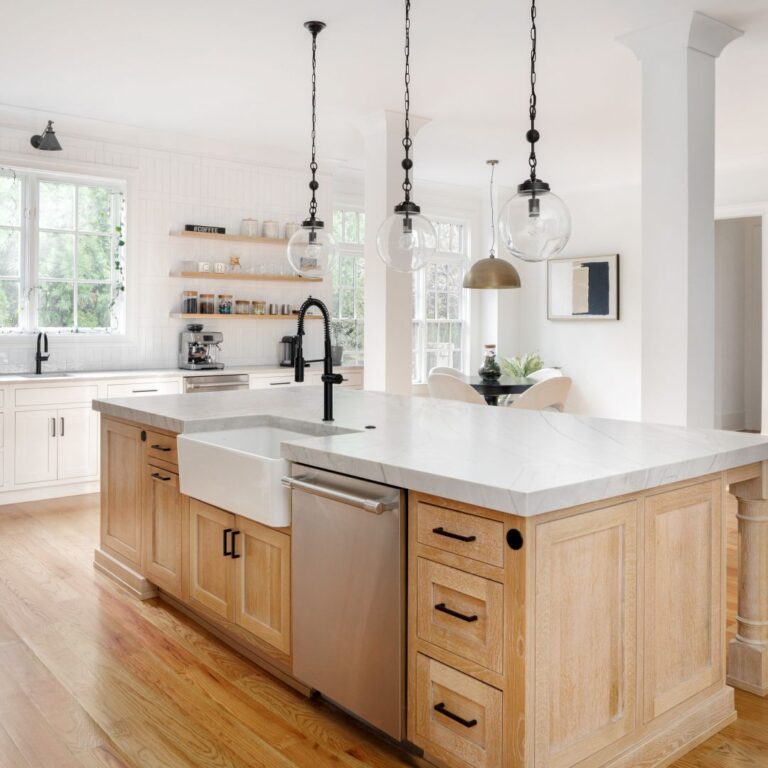 this gorgeous buckhead kitchen makeover features a large natural wood tone island with white kitchen cabinets and black hardware