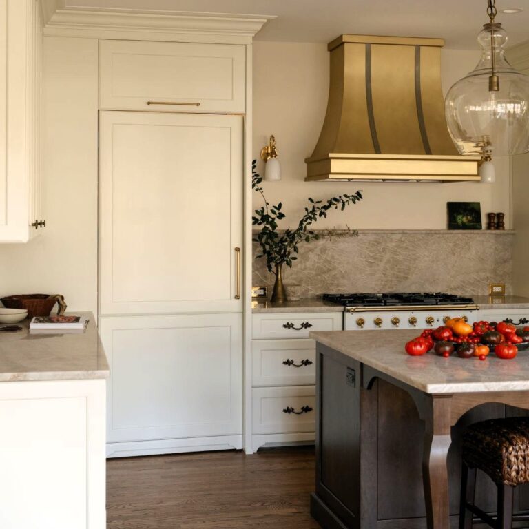 the door to the hidden pantry in this Sandy Springs home matches the appliance panel on the refrigerator