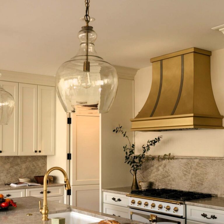 this beautiful kitchen renovation in Sandy Springs features custom cabinets, quartzite counters, luxury appliances, and a hidden pantry