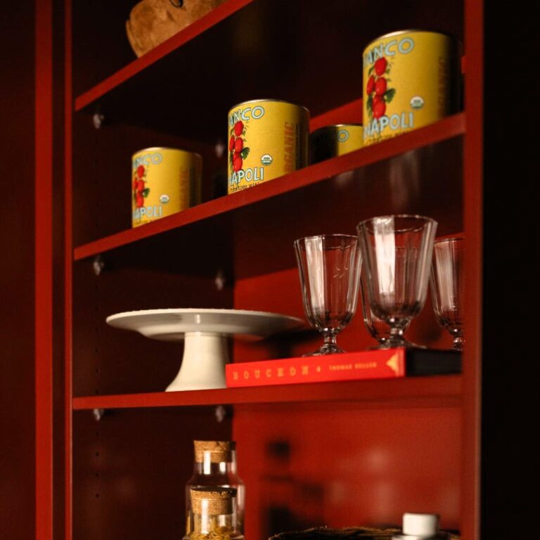 close up of shelf in hidden pantry in Sandy Springs home with Red Rock paint