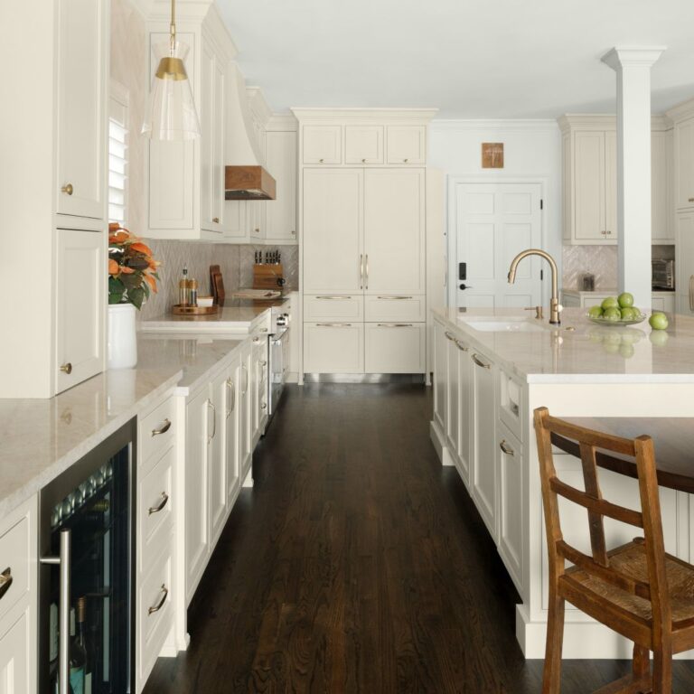 Hardwood flooring and warm neutral cabinetry in Vibrant Vinings kitchen design