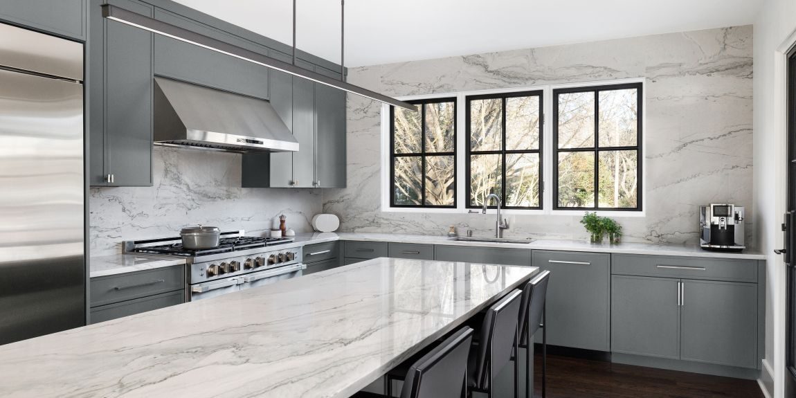 modern buckhead kitchen renovation with grey cabinets white quartz with grey veining and large island seating four