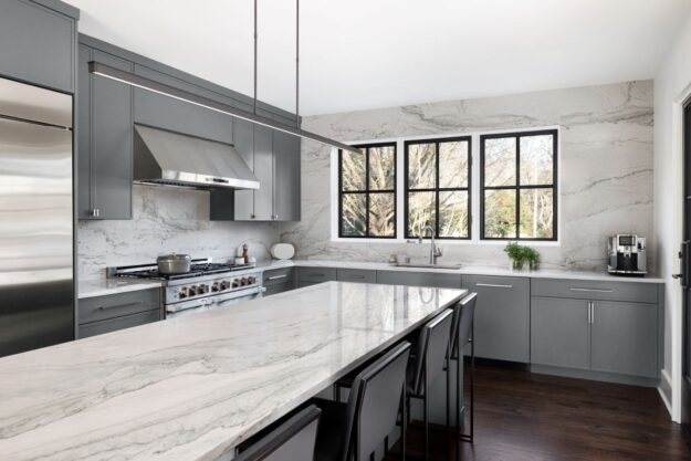 modern buckhead kitchen renovation with grey cabinets white quartz with grey veining and large island seating four