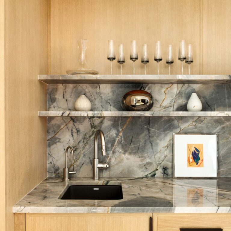 close up of wet bar in contemporary buckhead renovation featuring light wood with grey quartzite for a dramatic contrast