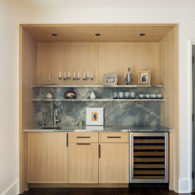 contemporary wet bar and beverage station in buckhead renovation with light wood, bar sink, wine cooler, shelves and recessed lighting