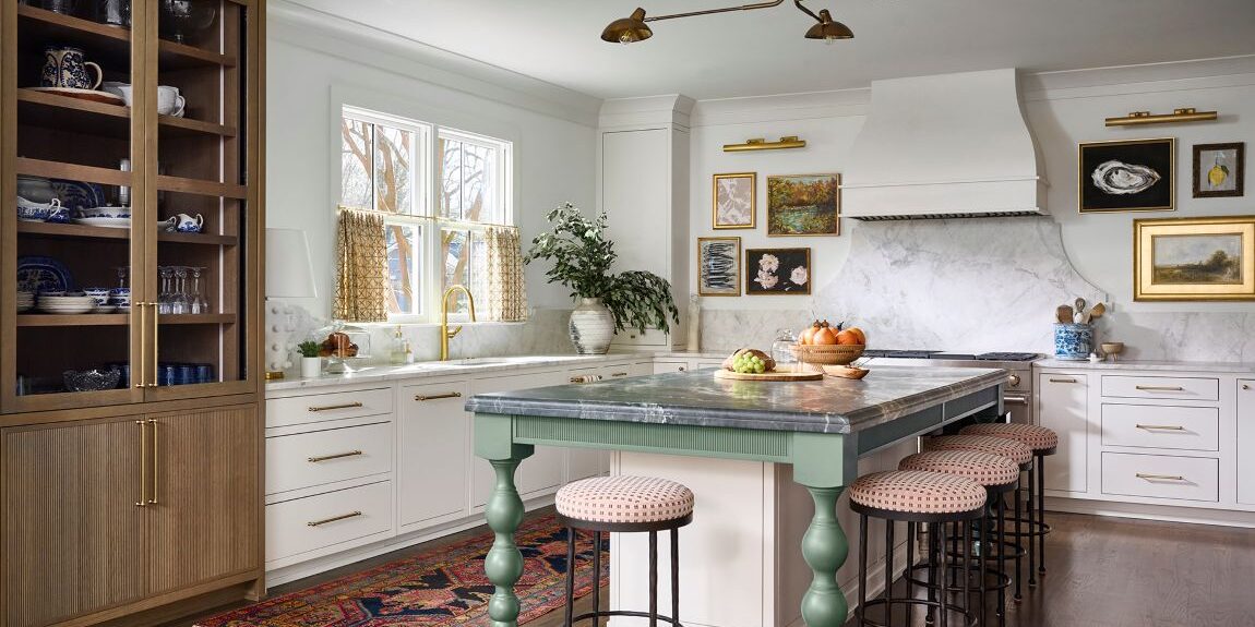 Atlanta kitchen remodel with custom cabinetry, marble backsplash, brass hardware, furniture-style green island, warm wood display cabinet, and layered traditional-modern design details